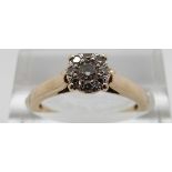 A 9ct gold ring set with diamonds in cluster, size K, 2.