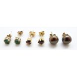 Two pairs of 9ct gold earrings, one set with emeralds and the other garnets,