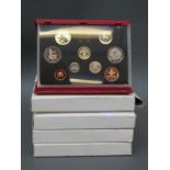 Five Royal Mint deluxe proof coin sets for 1985, 1986, 1988, 1990 and 1992,