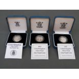 Three Royal Mint UK silver proof cased £1 coins one for 1988, the other two 1992,