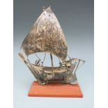 A white metal ship on stand, marked to keel silver 925, height of ship 18cm,