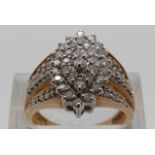 A 9ct gold ring set with diamonds in a cluster, size P,