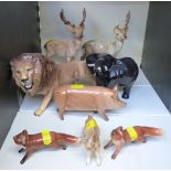 A collection of Beswick animal figures to include lion, deer, elephant, kid goat,