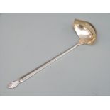A Georg Jensen hallmarked silver sauce ladle with GI and 925.