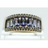 A 9ct gold ring set with tanzanites and diamonds, size O/P, 3.