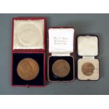 Three cased bronze Coronation medals to include two for George VI and an Edward VII example