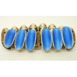 A silver bracelet set with blue guilloché enamel in oval panels by David Andersen,