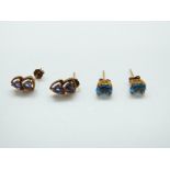 A pair of 9ct gold earrings each set with two tanzanites and a pair of 9ct gold earrings set with a