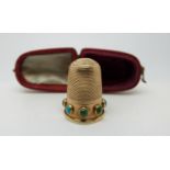 A 15ct gold Victorian thimble set with circular turquoise cabochons,