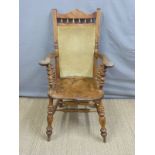 A 19thC Windsor captain's or similar chair with upholstered back
