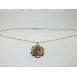 A Victorian 9ct rose gold open locket and chain,