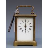 A French late 19thC /early 20thC carriage clock in brass corniche style case.