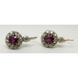 A pair of Victorian earrings set with natural, untreated round cut rubies,