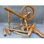 A small wooden spinning wheel with shuttles