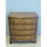 A bow fronted chest of four drawers,