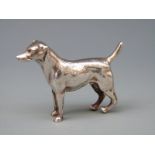 A white metal model of a dog, no visible marks, length 6.