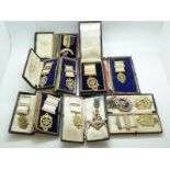 A quantity of Masonic openwork hallmarked silver or white metal jewels / medals, some cased,