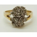 A 14ct gold ring set with diamonds in a cluster, 3.