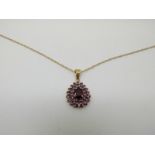 A 9ct gold pendant set with amethysts and 9ct gold chain