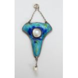 A silver pendant set with blue and green enamel and two pearls in the Liberty style by Gourdel