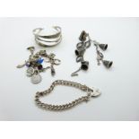 A silver charm bracelet with enamel bird charm, silver mermaid, silver car etc,