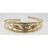 A 9ct gold bangle set with a heart shaped amethyst, 6.