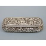 An Edward VII hallmarked silver repoussé decorated snuff or dressing table box,