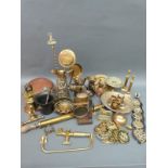 A collection of brassware to include blow lamp, horse brasses, garden sprayer, embossed jug,