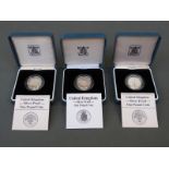 Three Royal Mint UK silver proof cased £1 coins two for 1987, the other 1988,