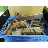 A collection of vintage woodworking planes including plough planes,