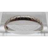 A platinum wedding band, size R,