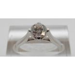 An 18ct white gold ring set with a modern round brilliant cut diamond of approximately 0.