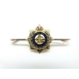 A 9ct gold regimental brooch