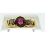 An 18ct gold ring set with a ruby of approximately 0.3ct and two diamonds, size O, 4.