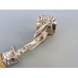 A French white metal ivory handled ham holder or clamp, with lion's claw decoration to clamp,