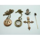 A yellow metal stick pin with sphere design, a yellow metal chain, two Victorian lockets,