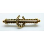 A Victorian / Edwardian brooch set with seed pearls in a horseshoe design, 5.