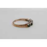 A 9ct gold ring set with emeralds and diamonds, size L,