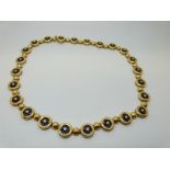 An 18ct gold necklace of alternating spheres,
