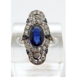 An Art Deco platinum ring set with an oval cut synthetic sapphire of approximately 2ct surrounded
