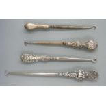 Four various hallmarked silver handled button hooks