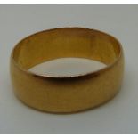 A 22ct gold wedding band, 7.