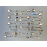 A quantity of white metal collector's spoons including examples marked sterling,
