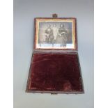 A leather cased daguerreotype or similar early photograph of a family group, size of photo 8.