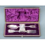 A cased silver plated christening set comprising spoon,