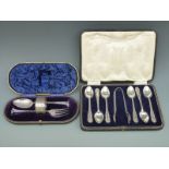 A cased set of six hallmarked silver teaspoons and tongs and a further cased christening set