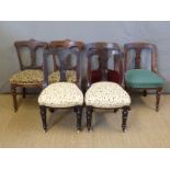 A harlequin set of six Victorian carved back dining chairs