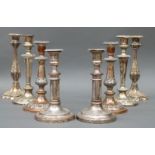Four pairs of plated candlesticks including an extending Sheffield plate pair