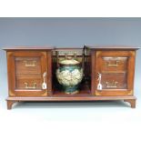 An Edwardian inlaid mahogany twin pedestal smoker's cabinet with brass rail,