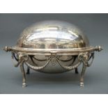 A silver plate warming dish with goat head and swag decoration,